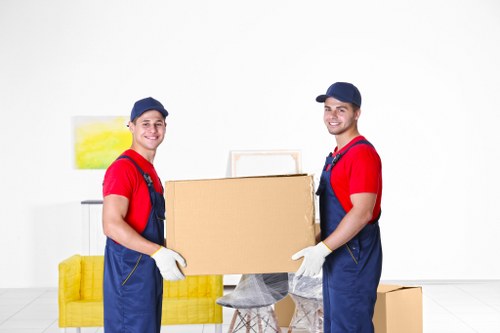 Same day removals team loading furniture in Barnes