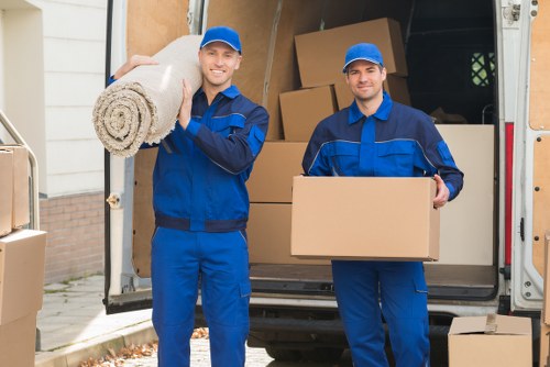 Loading furniture into a removal van in Barnes