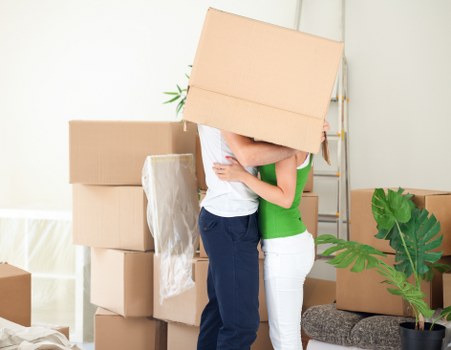 Moving team handling boxes safely during a Barnes van service