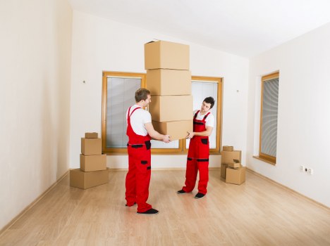 Professional movers handling office furniture in Barnes