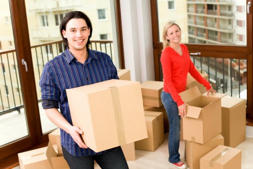 Packed moving boxes and furniture ready for transport in Barnes